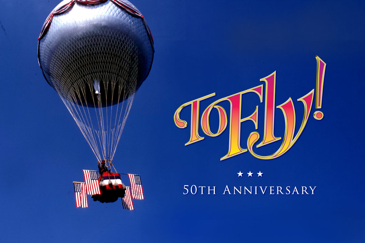 A poster for To Fly! 50th Anniversary, featuring a hot air balloon against a bold blue backdrop.