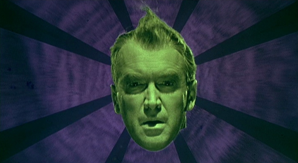 A still from Vertigo featuring James Stewart's head in front of a cartoon background.