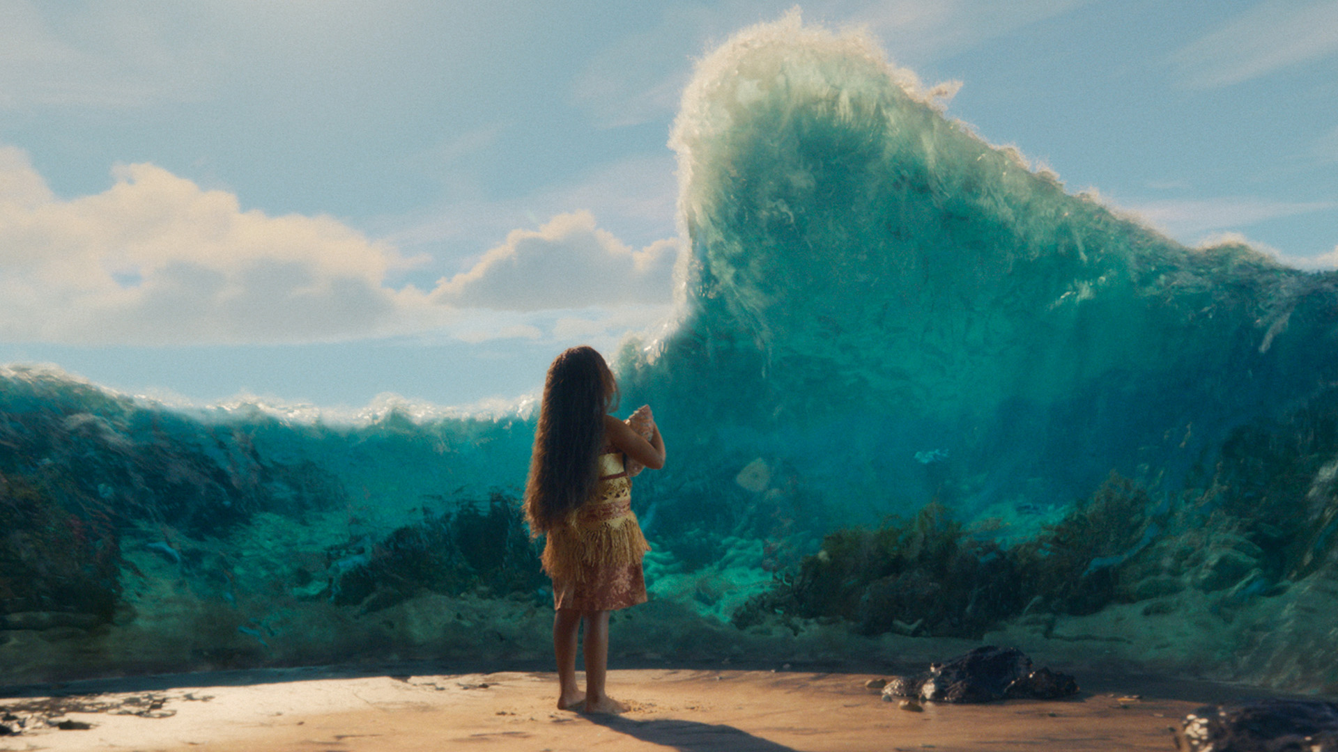 A young girl stands on a beach as a large wave rises above her.