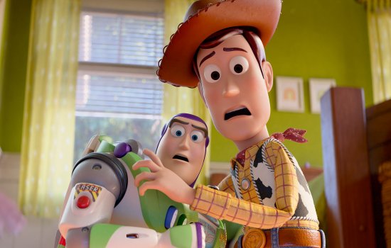 Woody and Buzz Lightyear huddle together, looking fearful.