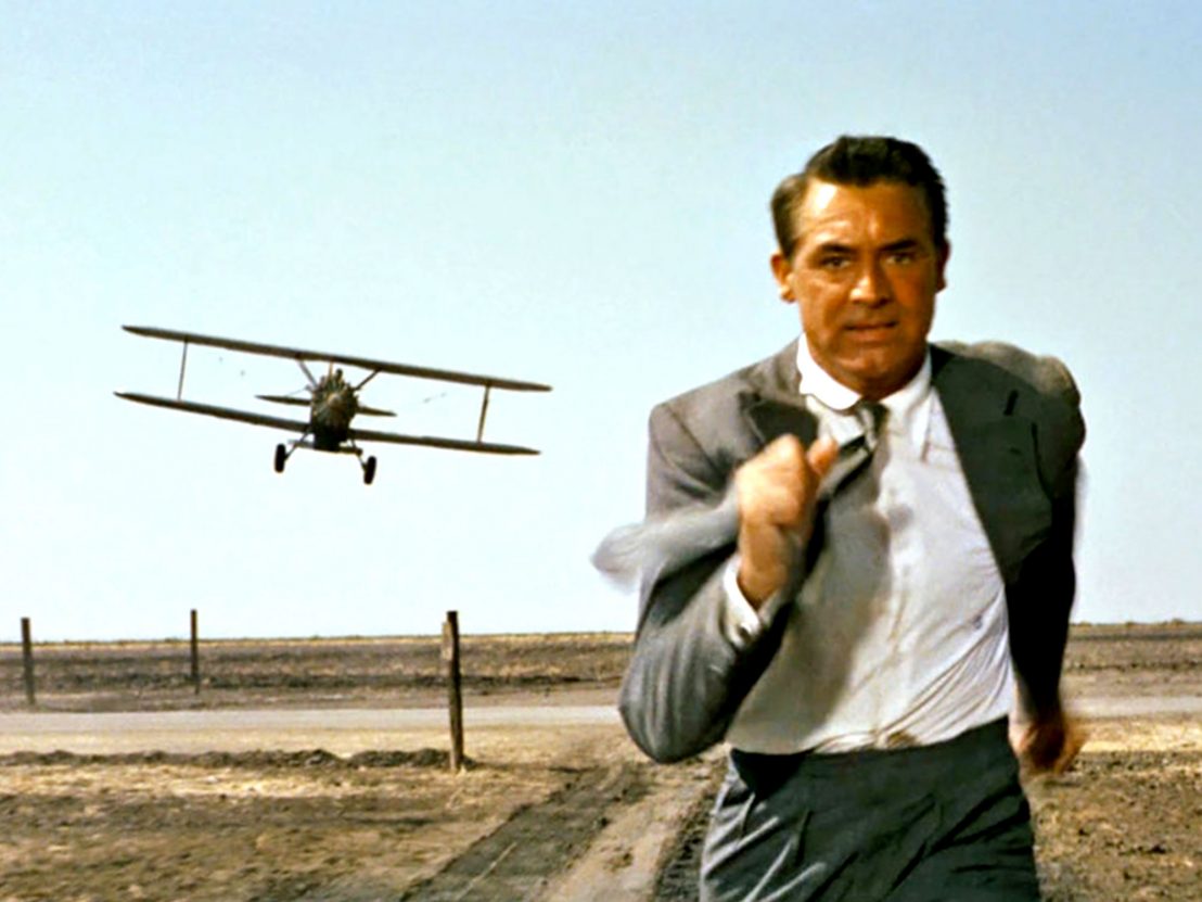 Cary Grant is chased by a crop duster in an iconic shot from North by Northwest