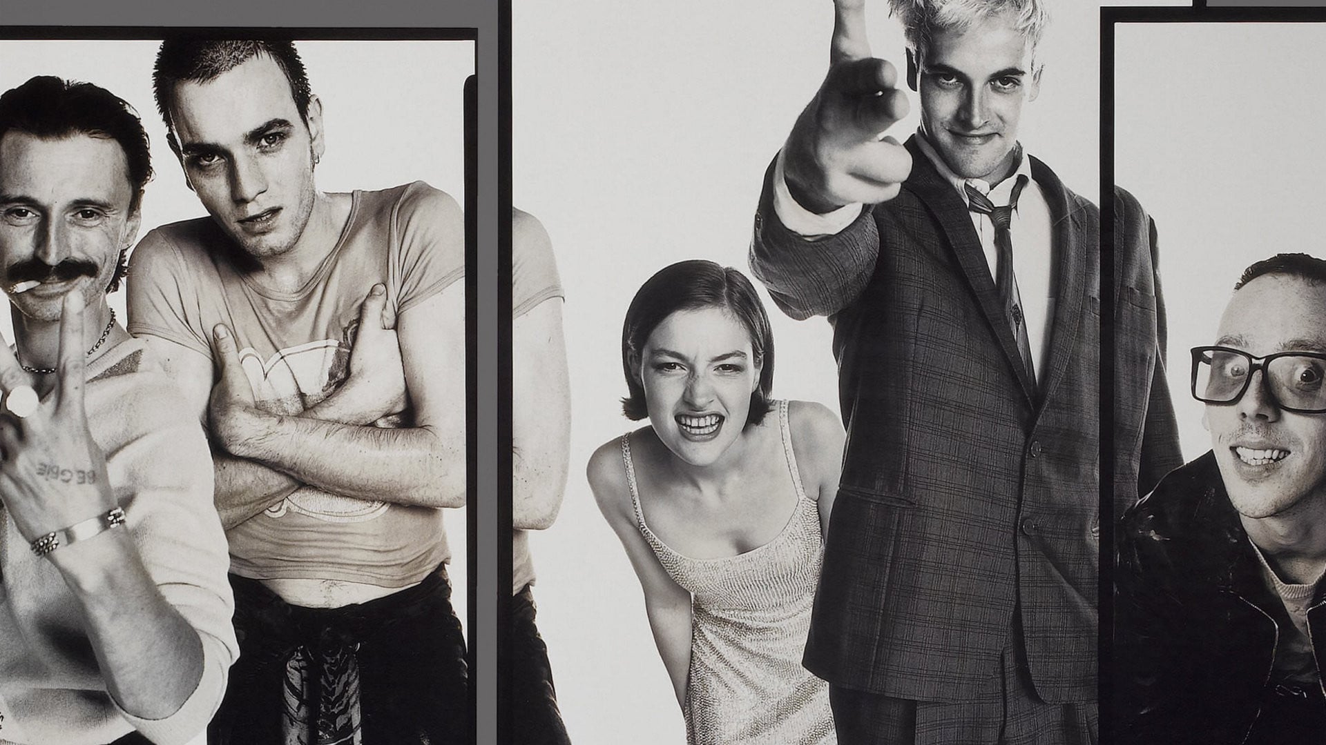 Black and white promotional image for Trainspotting, showing the cast in various poses
