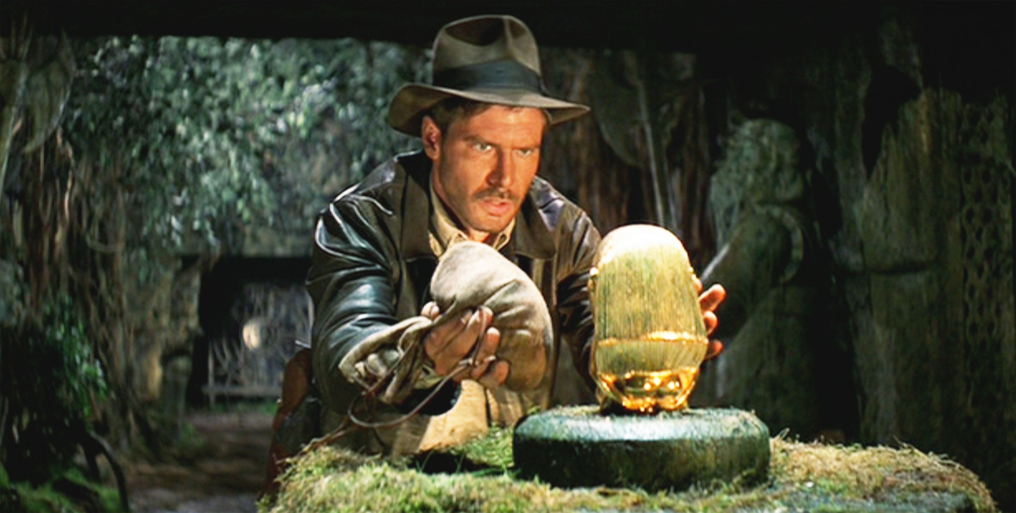 Harrison Ford reaches out for a gold idol.