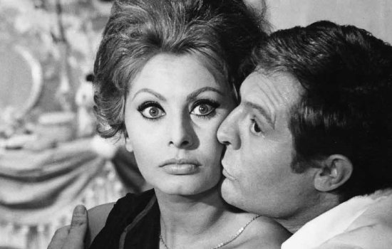 A black and white image of Sophia Loren and Marcello Mastroianni embracing.