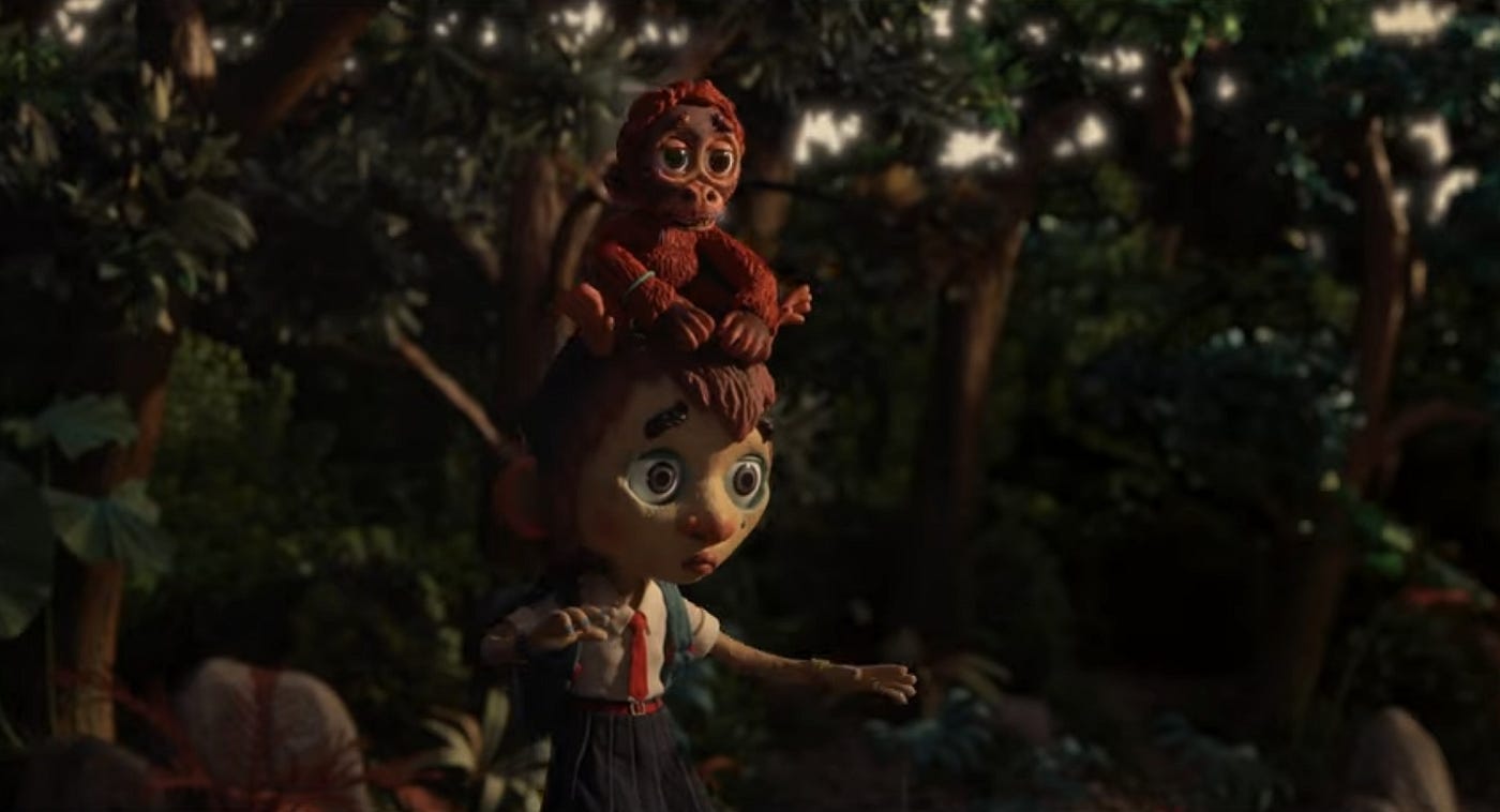 A n animated image of a young boy with a baby orangutan on his head.