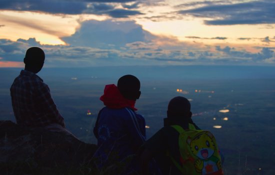 A group of people look out at a landscape