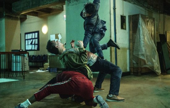 Still from The Furious, three people are centre of the frame mid-brawl.