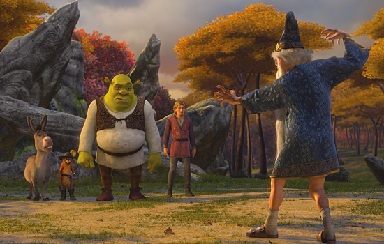 A still from Shrek the Third of Shrek, Donkey, Puss in Boots and Arthur stood looking quizzically at an old man dressed in wizard robes.