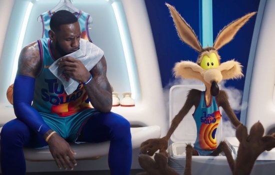 A still from Space Jam: A New Legacy in which LeBron James is sat next to a Looney Tunes character.