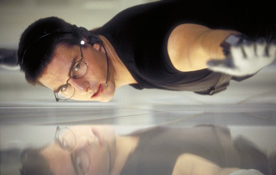 Tom Cruise hangs centimetres from the floor in one of the iconic images from Mission: Impossible.