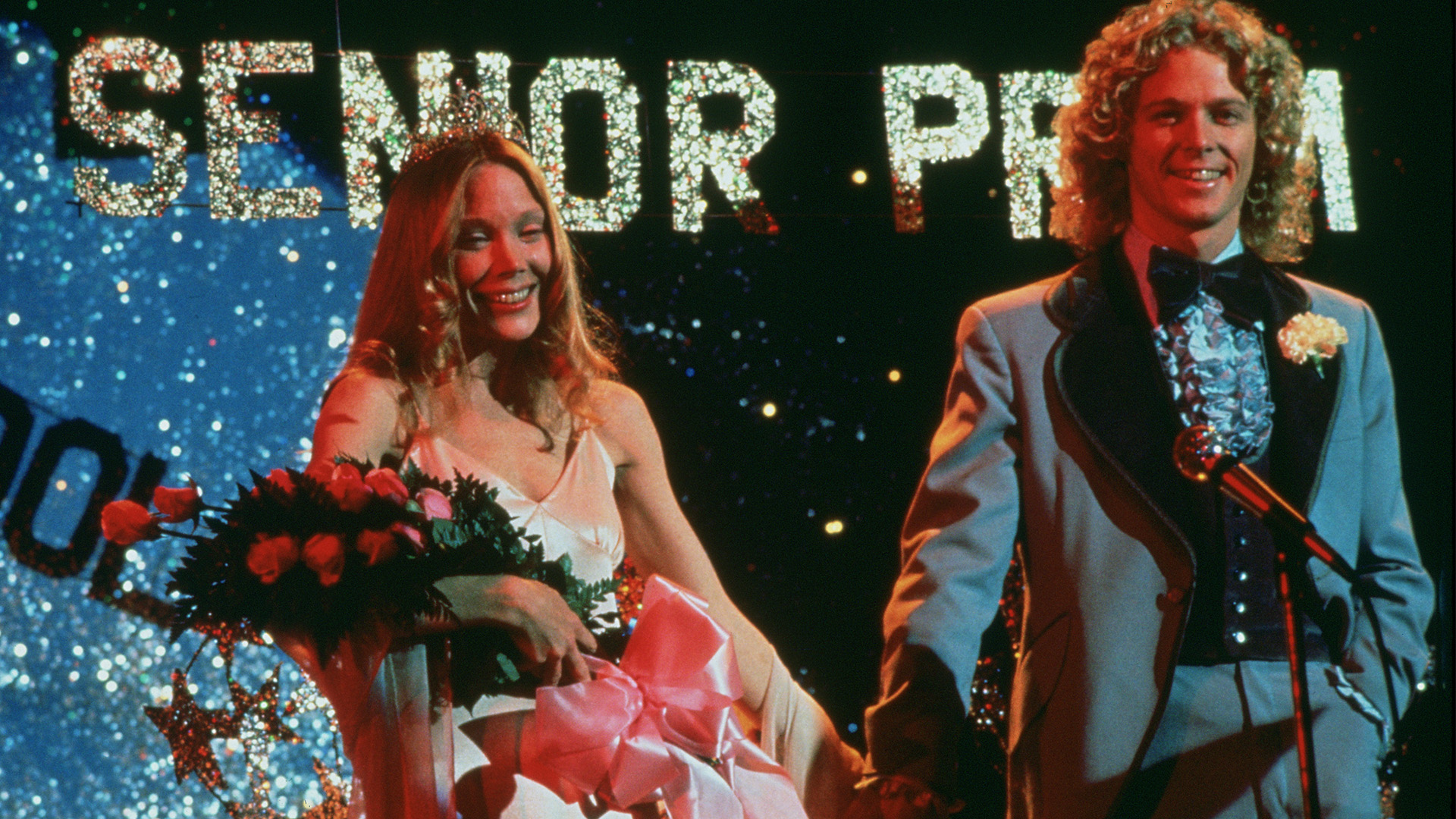 A still from Carrie of Sissy Spacek holding flowers at senior prom.