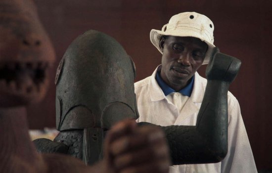 A man inspects a museum object.