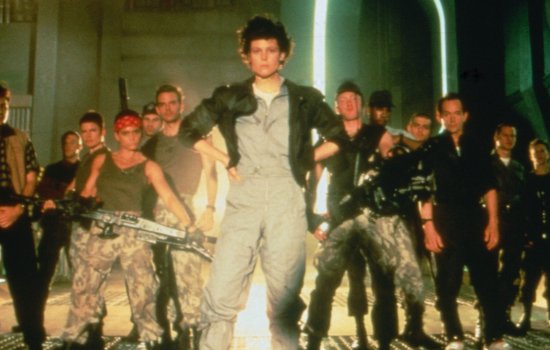 A still from Aliens of Ripley stood in front of a group of marines.