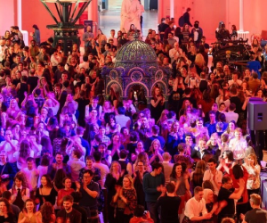 A large crowd of people in the Grand Gallery of the National Museum of Scotland. 