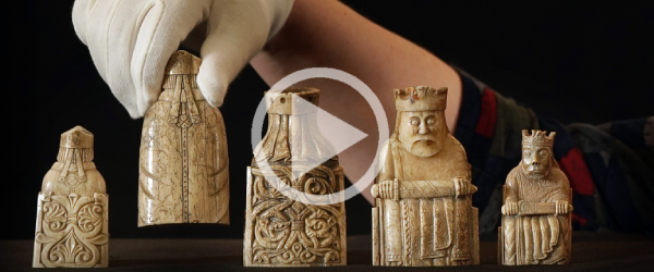 A screenshot of a video depicting the detailed and intricate back of the Lewis chess pieces. 