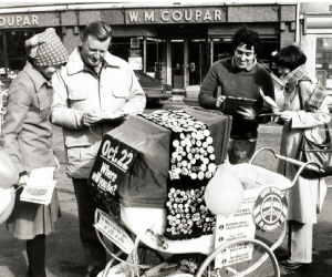 Campaigners strand around a pram while discussing  the campaign for Nuclear Disarmament in Blairgowrie. 