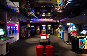 Wide view of arcade games in the Game On exhibition at Norsk Teknisk Museum, Oslo