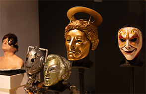 Five villain masks from the Doctor Who TV programme on display in the exhibition. From l-r: Half faced Man in Victorian costume, Handles Cyberman Helmet, SV7 SuperVoc Head, Clockwork android mask and Heavenly Head.