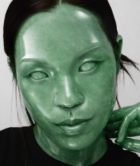An image of a person with green stone-like skin. 
