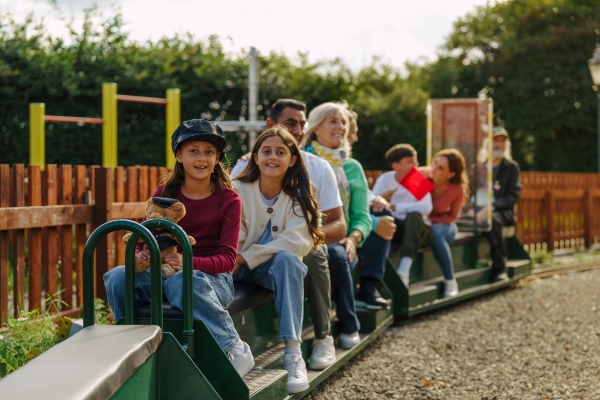 A family sitting on the Miniature Railway