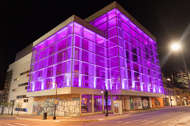 Overture Exterior, lit with purple lights