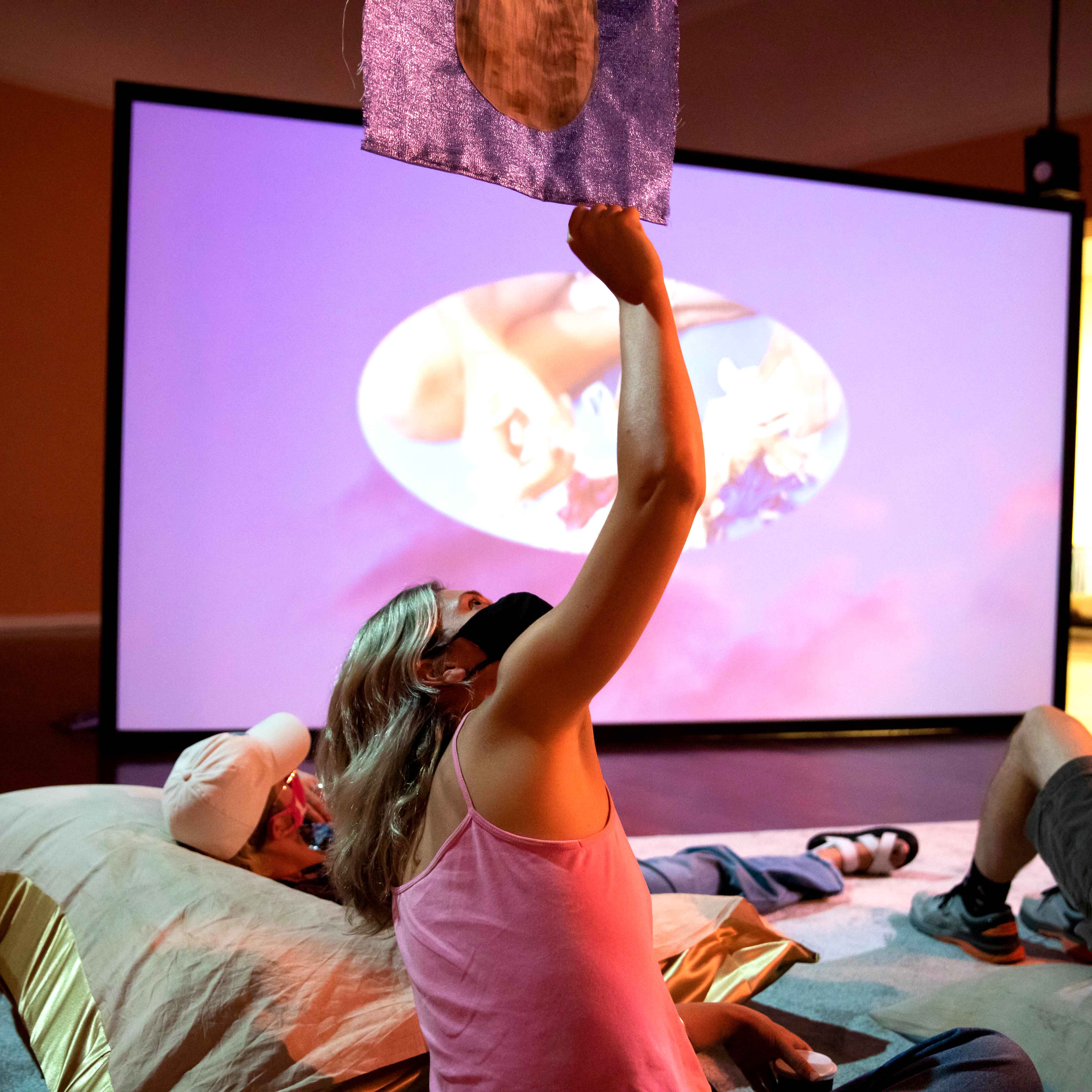 Image: Four people gather together in conversation