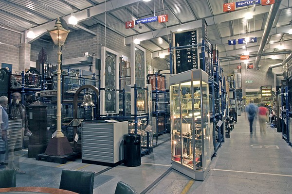 Image of the Open Store at the Science Museum, featuring a lamp post, several traffic signs, and a glass display case.