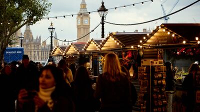 Lots of people walk through Southbanks busy Christmas market stalls