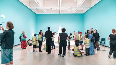 A group of students observing a sculpture in the Hayward Gallery.