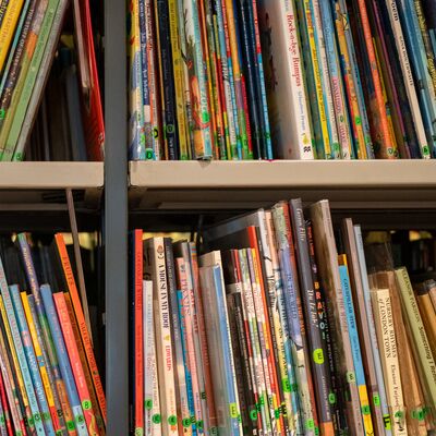 A bookshelf lined with various children's' books
