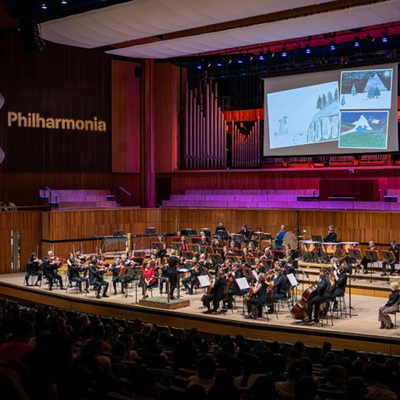 London Philharmonia Orchestra playing on stage in the Royal Festival Hall.
