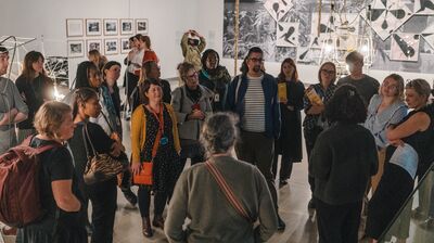 A group of teachers stood in a circle inside the Hayward Gallery