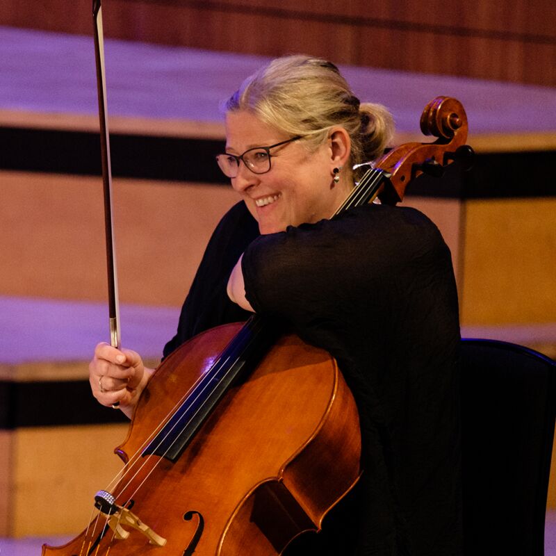 Karen Stephenson with a cello in the Royal Festival Hall, credit Luca Migliore