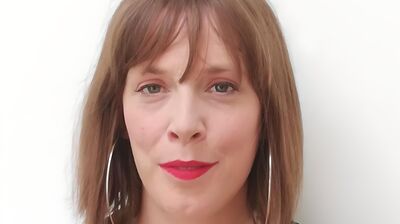 Jess Phillips wears silver earrings