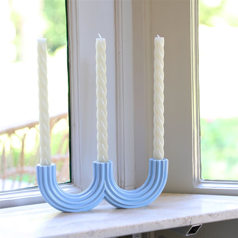 A churros-inspired candle holder in pale blue