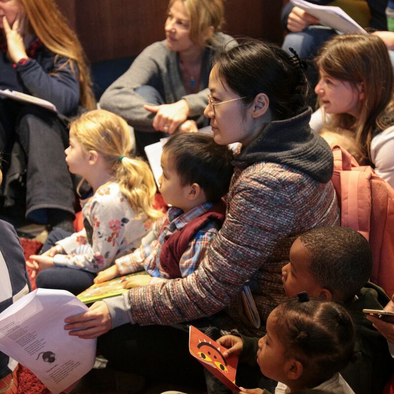 Young children with their parents/guardians at a Rug Rhymes session at the National Poetry Library