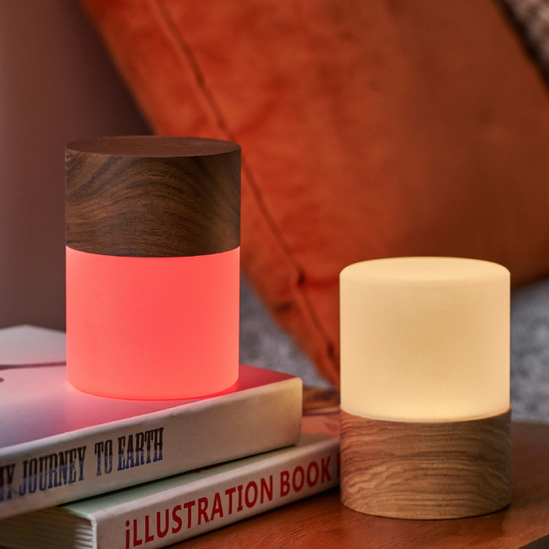 Two small lights on a bedside table