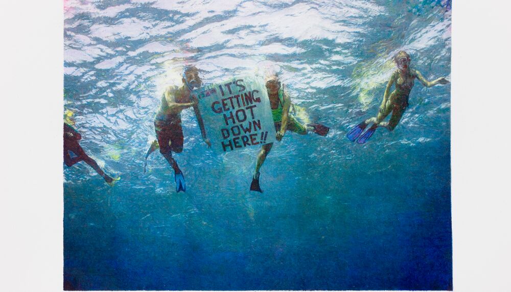Scuba diving activists holding a poster sign under the sea 'IT'S GETTING HOT DOWN HERE!!'