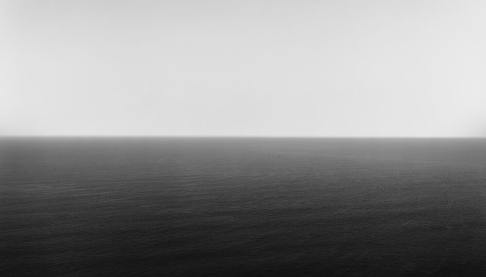 A black and white photo of an ocean