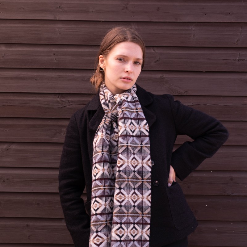 A woman wearing a patterned scarf