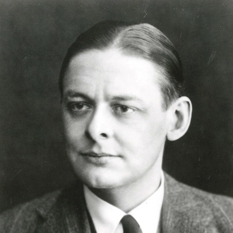 Portrait of poet, T.S. Eliot wearing a suit and staring intently to the left of the frame