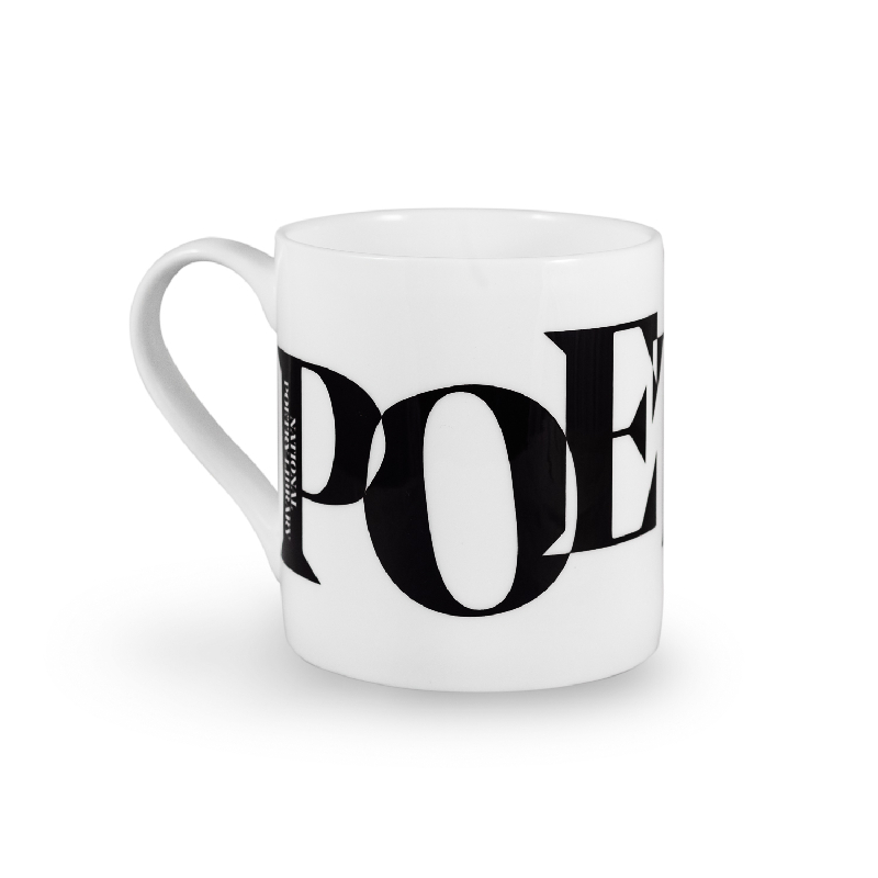 A white mug with three black letters on the side: P O and E