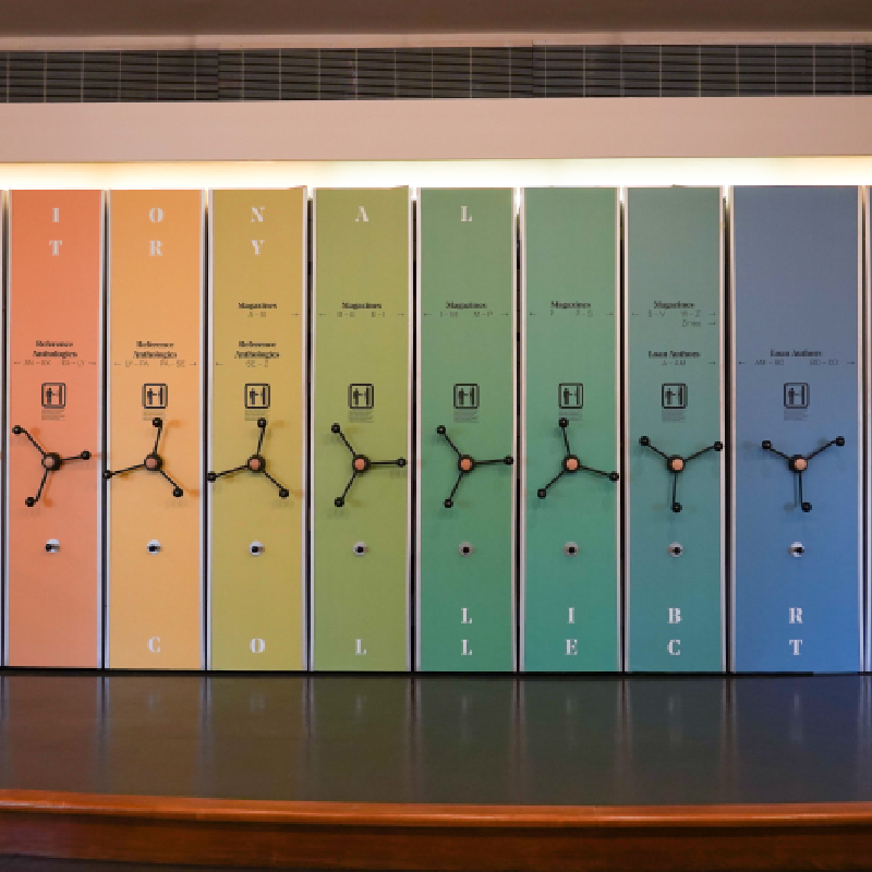 A row of colourful lockers in rainbow order from orange to blue