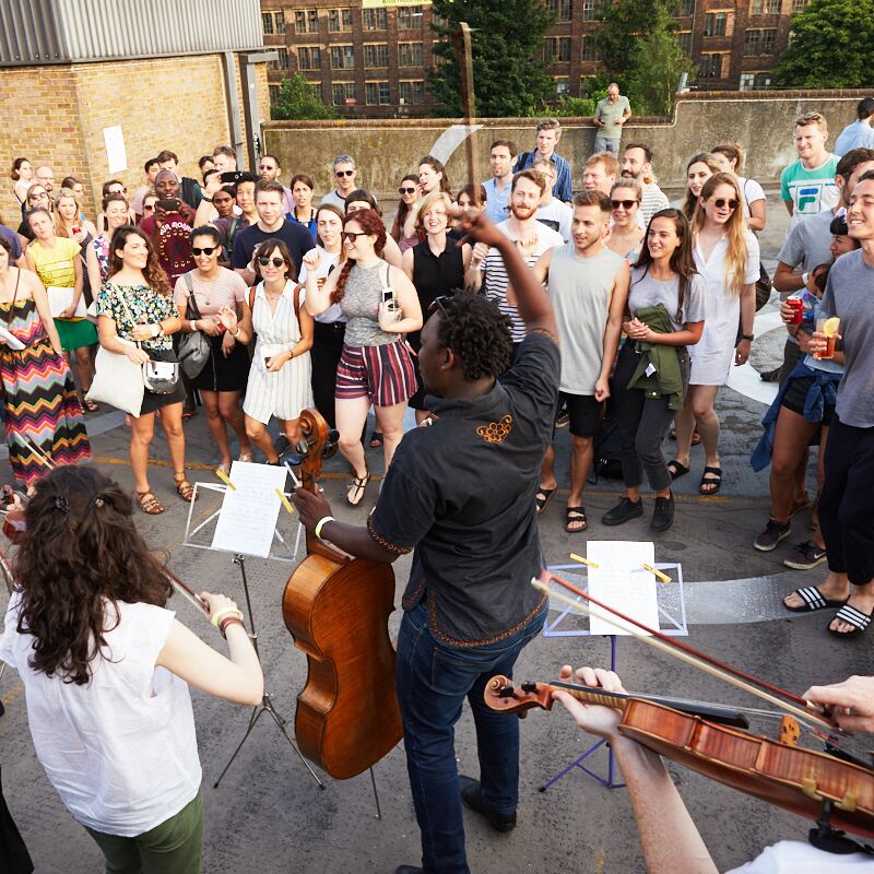 Multistory orchestra performs its Living Notes programme in Kings Cross area.