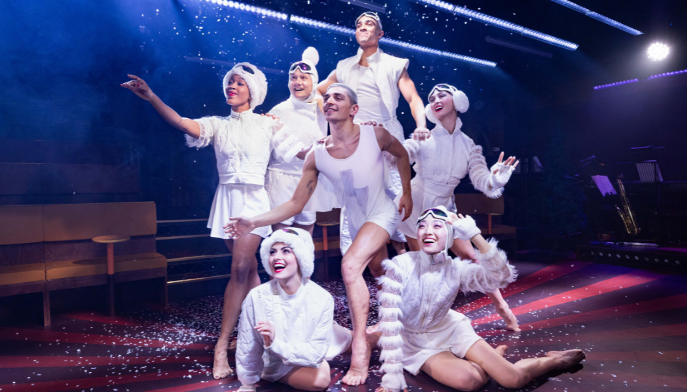 Cast of the Nutcracker in the theatre, all wearing white clothes