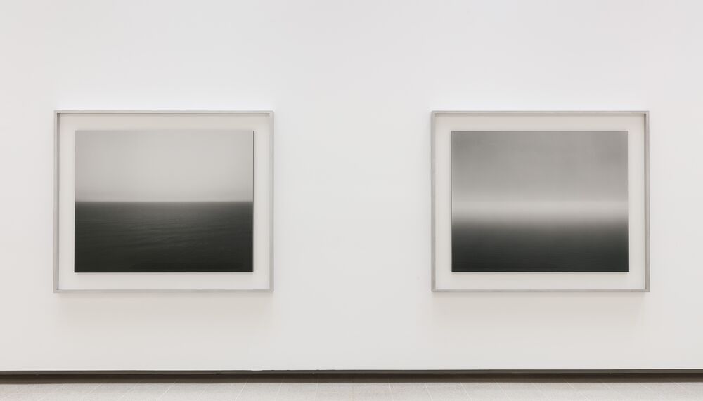 Two of Hiroshi Sugimoto's Seascapes photographs against a white wall.