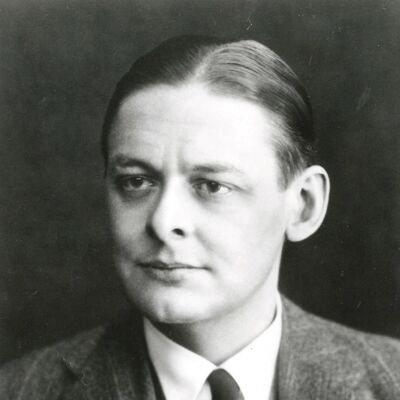 Greyscale portrait of a man with slicked hair and waring a suit, shirt and tie