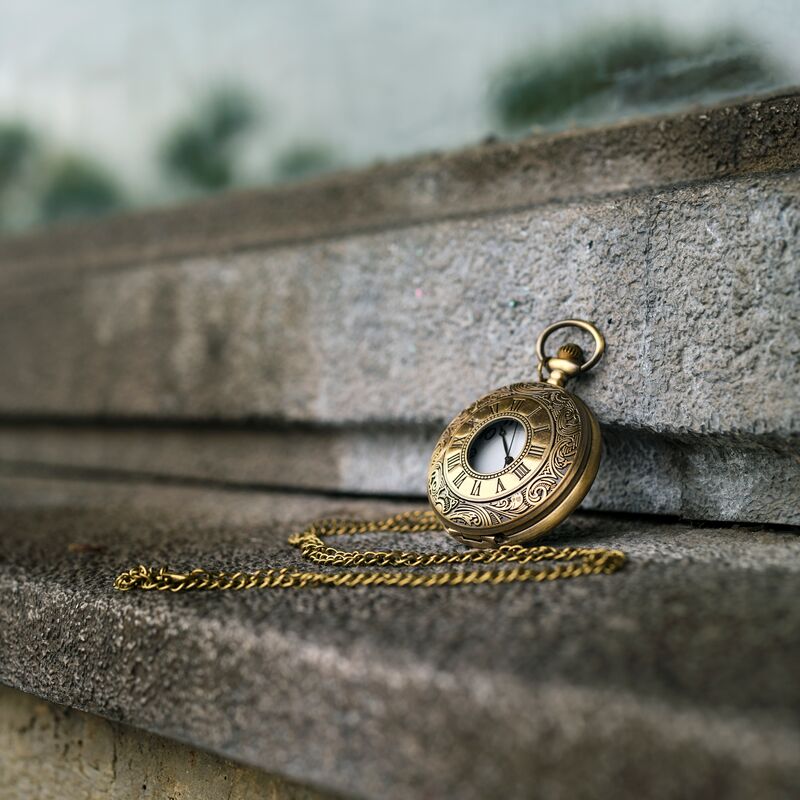 A pocket watch on a wall