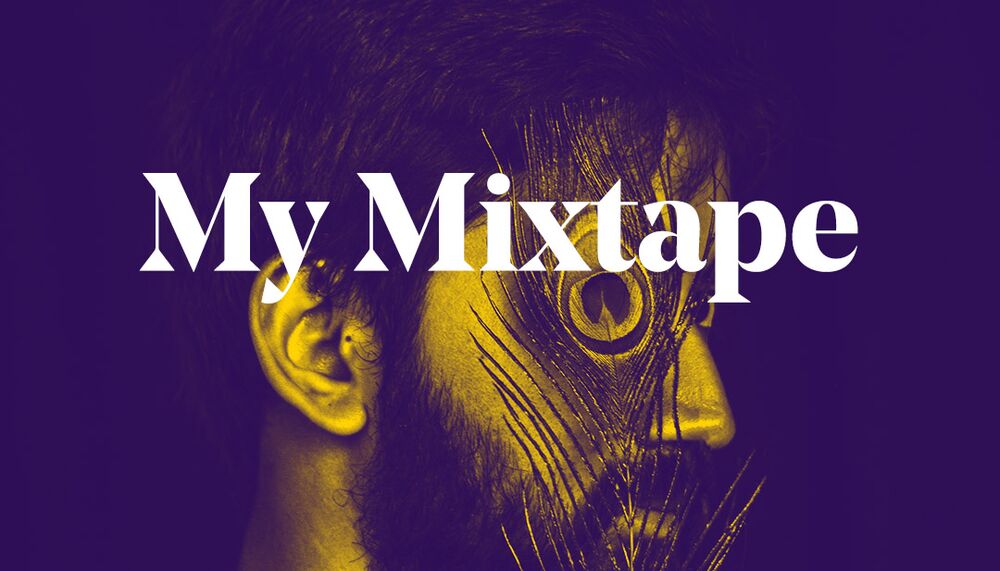 Sarathy Korwar, a man of Indian background, side on with a peacock feather covering his eye. The words 'My Mixtape' overlay the image in white text