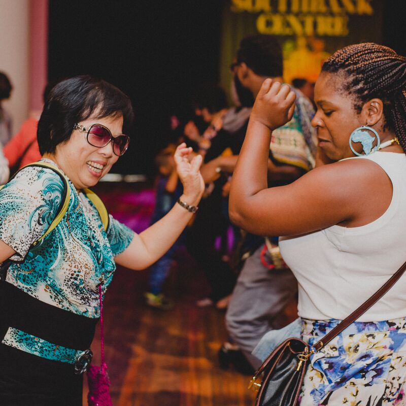 Two women enjoying dancing at the Southbank Centre